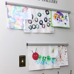 How to display kids artwork - easily change out art with ticket hangers. Brilliant!
