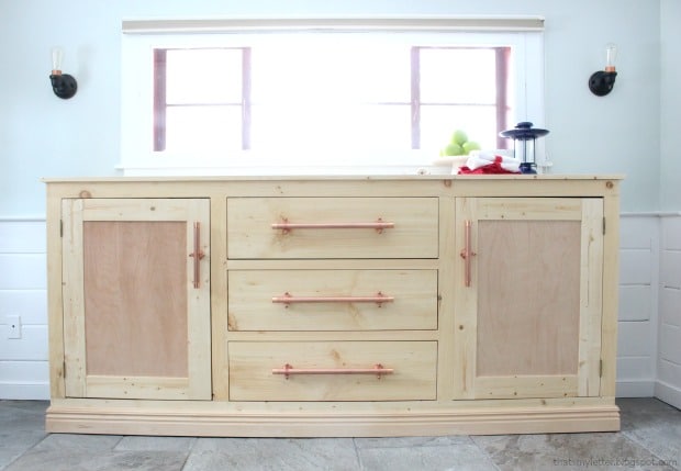 Natural wood and copper sideboard by That's My Letter