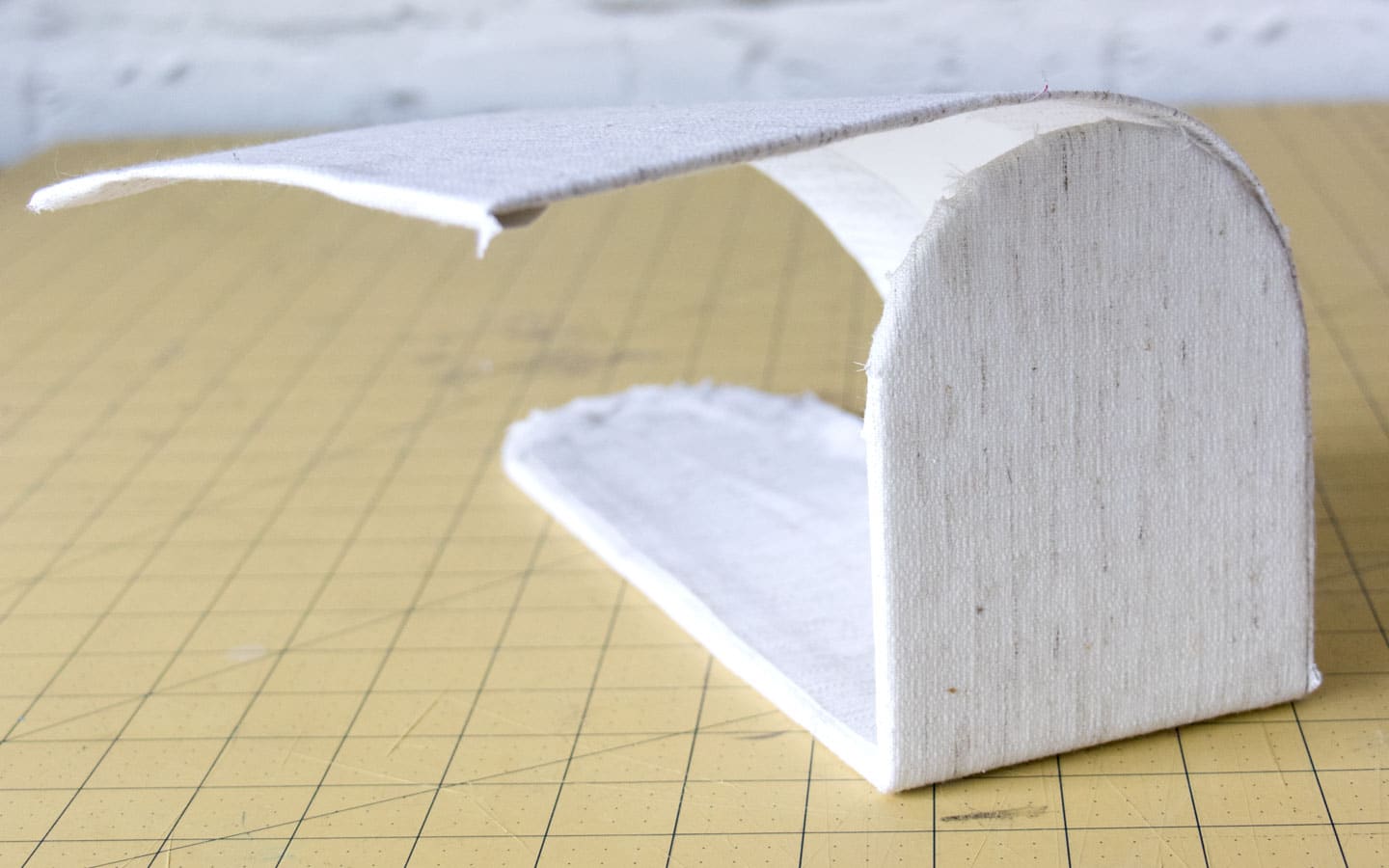 DIY Valentines Mailboxes made from fabric, cardboard and wooden candle sticks.