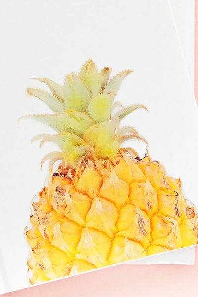 DIY Pineapple Notebook - Create your own tropical stationery with this tutorial using printable temporary tattoo paper. Click through for the how-to!