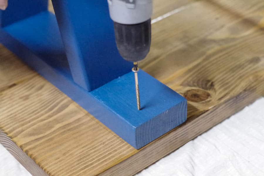 Easy DIY Outdoor Bench - Use wood glue and screws to attach the legs to the top.