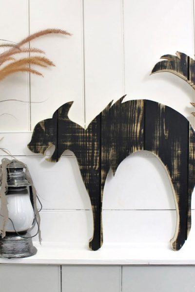 large black cat wood cut out on ledge