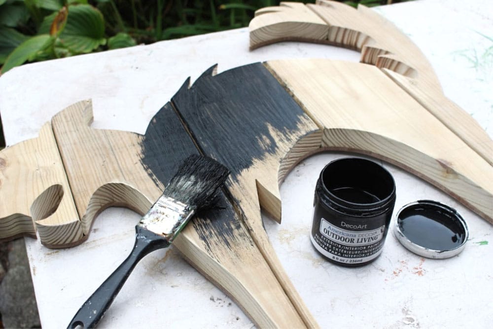 A DIY tutorial to create a large black cat silhouette cut out from wood. Make a statement with a big black cat as part of your Halloween decor. painting wood cut out