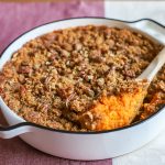 The BEST sweet potato casserole recipe! Creamy and rich sweet potatoes with a crumbly brown sugar pecan crust!
