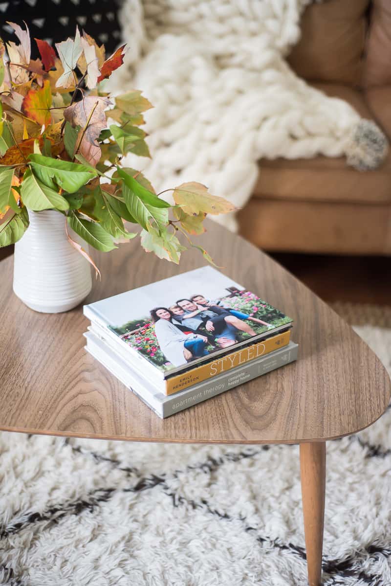 family photo book displayed on mid century coffee table