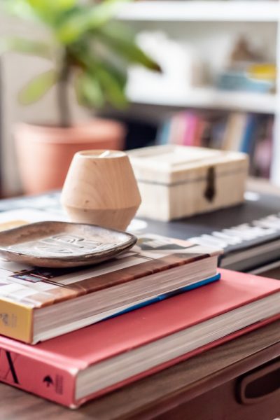 stacked books on mid century coffee table