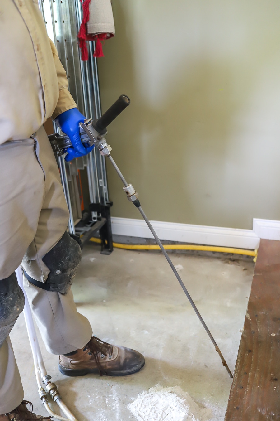 Applying Orkin Pest control termite treatment