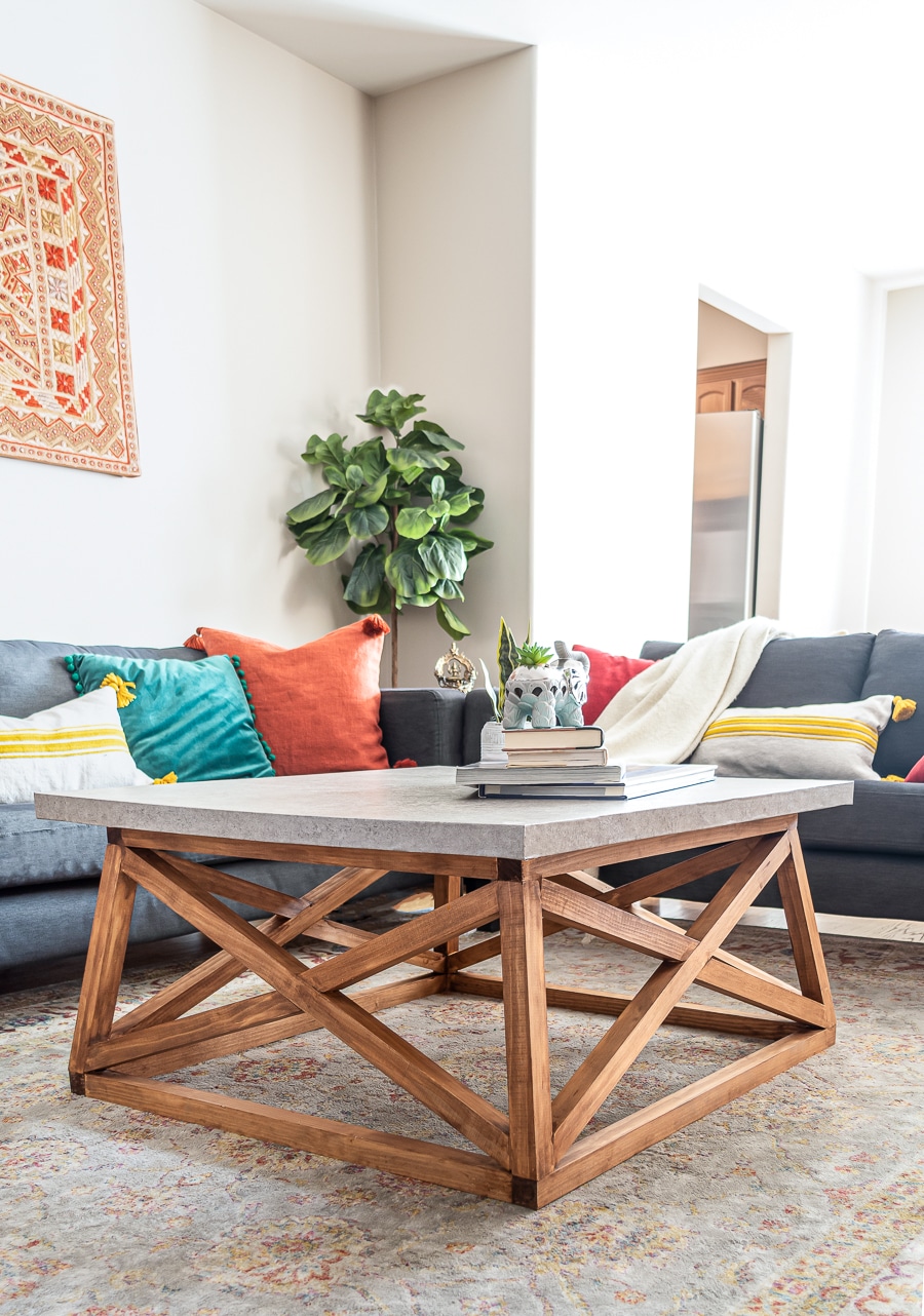 How to build a DIY Angled X Base Coffee Table with a Concrete Top - Free plans!