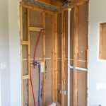 Guest bathroom renovation plumbing rough-in and floor leveling
