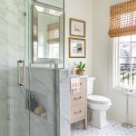 Stunning guest bathroom renovation featuring marble mosaic tile and vintage accents