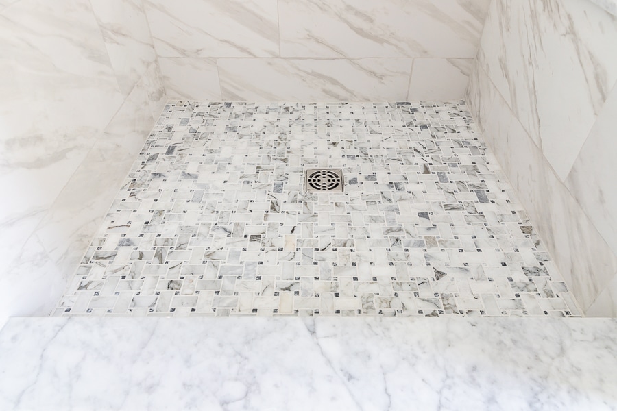 Basketweave marble mosaic tile on shower floor