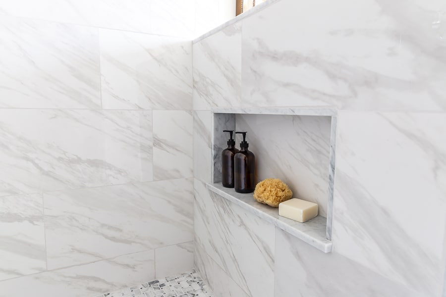 Large format tile on shower walls with niche