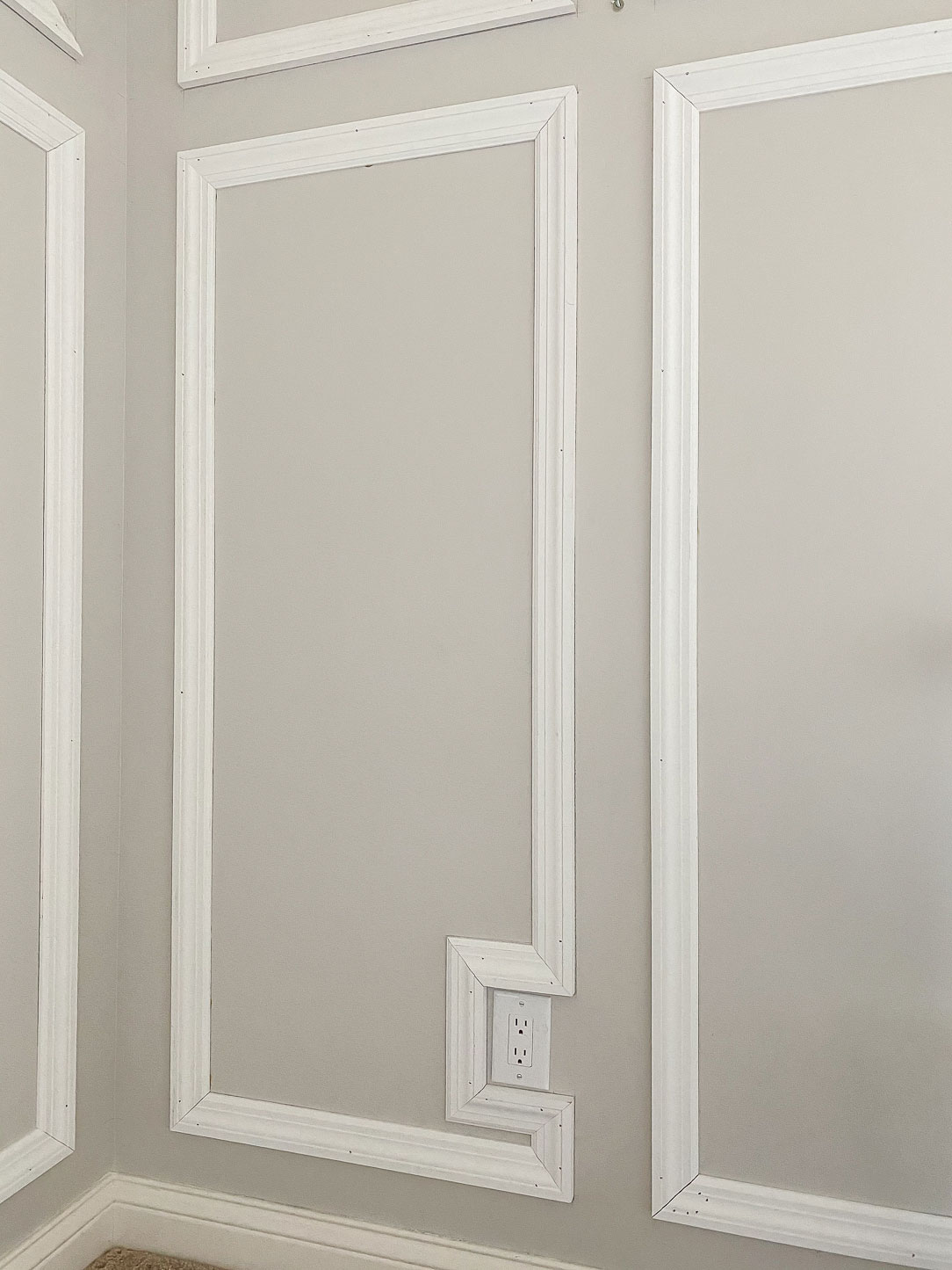 You can either move the outlet or trim around it