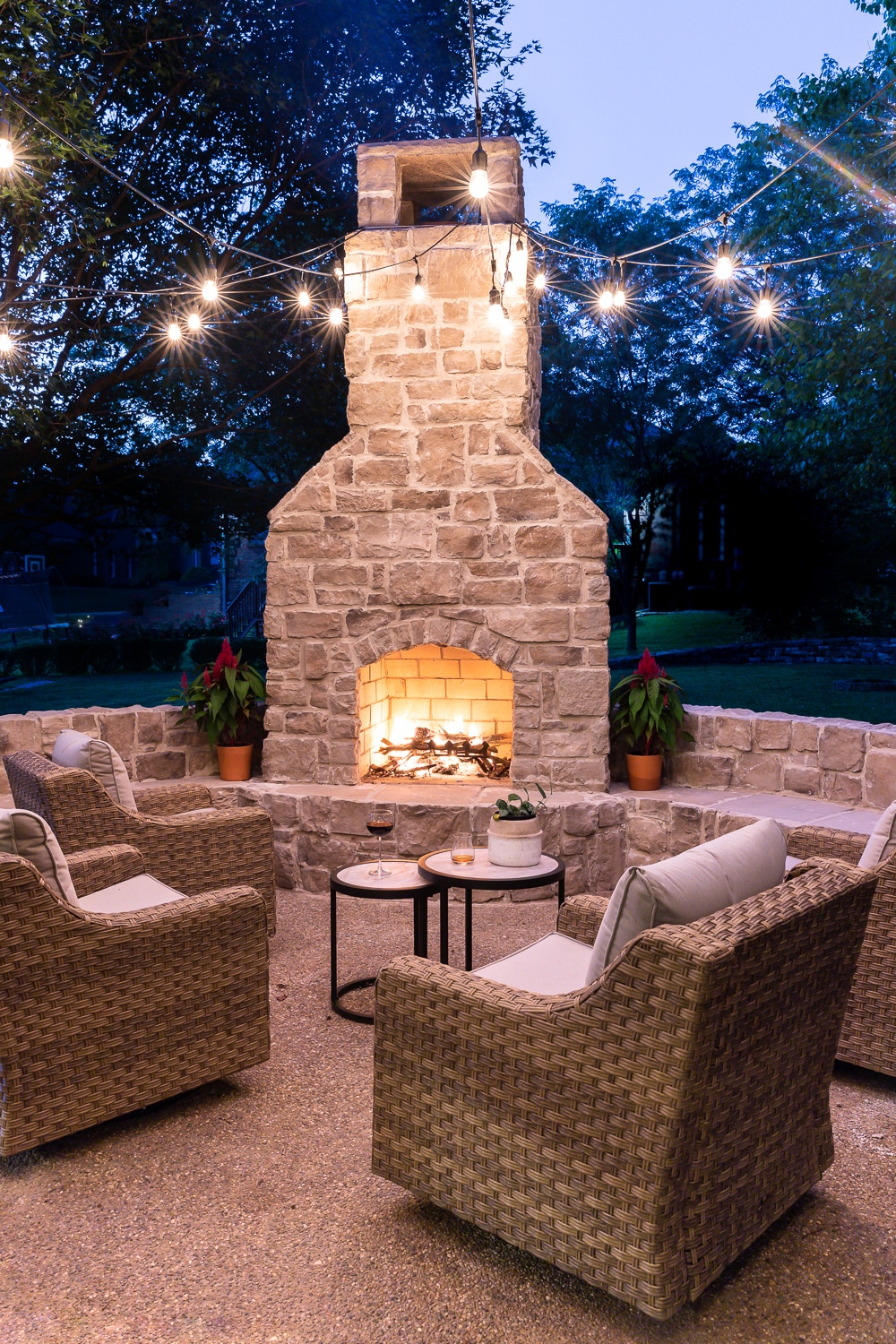 Gorgeous outdoor fireplace on a curved patio - with bench seats